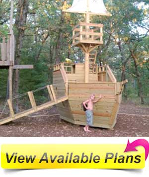 a large pirate ship playhouse in the backyard